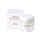 Skincare cream jar and box with gold accents on a white background