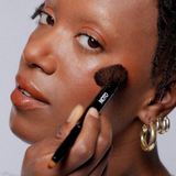 noto lip and cheek duo brush in use