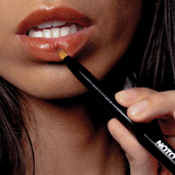 noto lip and cheek duo brush in use